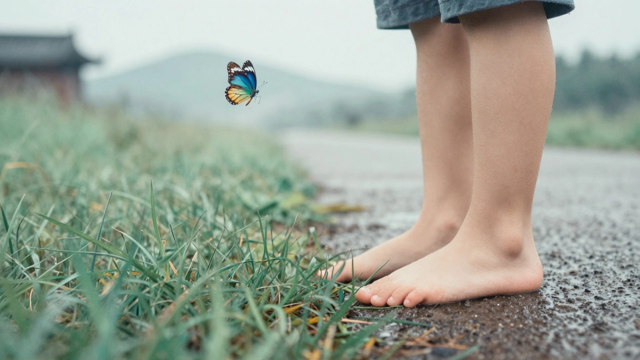 A bare foot touches cool grass as a butterfly fades into mist, with distant hills and a hidden temple behind.